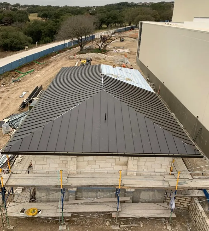 Metal roof new construction with scaffolding in Jennings